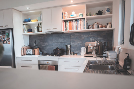 Modern kitchen with refrigerator and compact appliances in a bright home